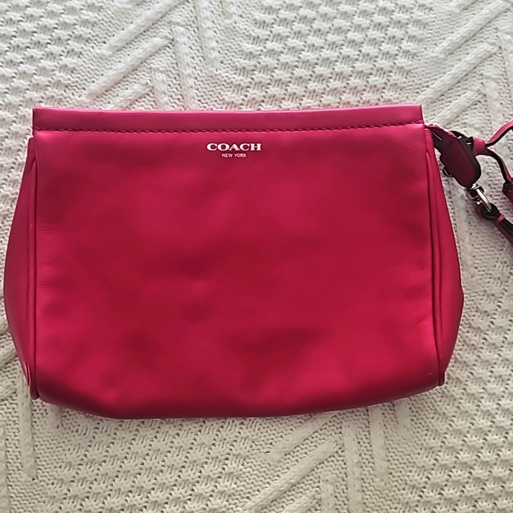 Coach Pink wrist bag.